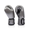 Pair of silver and black fairtex bgv1c plus microfibre boxing gloves on a white background side view
