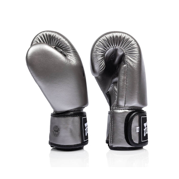Pair of silver and black fairtex bgv1c plus microfibre boxing gloves on a white background side view
