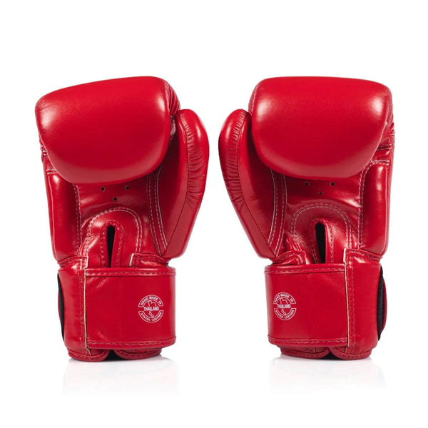 Red fairtex bgv1c plus boxing gloveson a white background back view of velcro closure