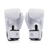 Pair of white Fairtex bgv1c plus boxing gloves with black accents on a white background