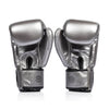 Pair of silver and black fairtex bgv1c plus microfibre boxing gloves on a white background back view of velcro closure