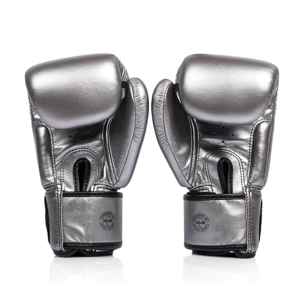 Pair of silver and black fairtex bgv1c plus microfibre boxing gloves on a white background back view of velcro closure
